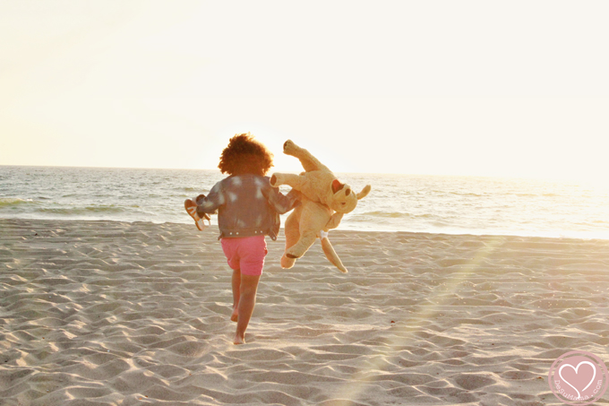 biracial girl at the beach in california