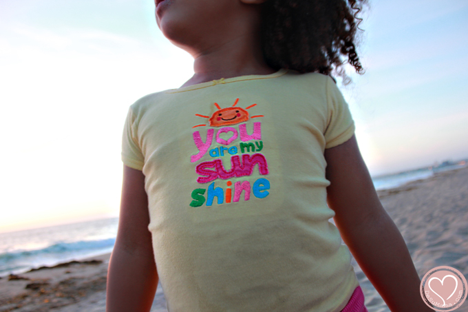 biracial girl at the beach in california