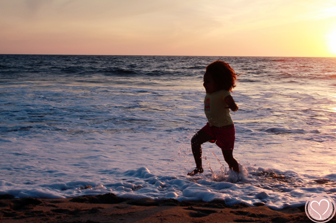 biracial girl at the beach in california