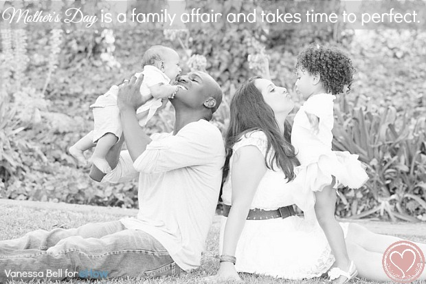a mixed family kissing mom on mother's day