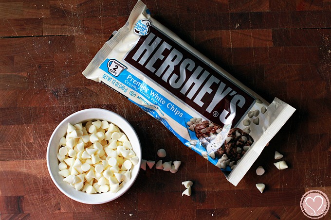 Blueberry Bread Pudding with White Chocolate Chips and Strawberry Sauce, perfect for 4th of July desserts