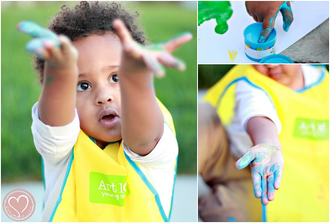 Biracial Boy Learning to Finger Paint