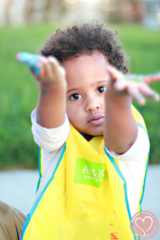 Biracial Boy Learning to Finger Paint