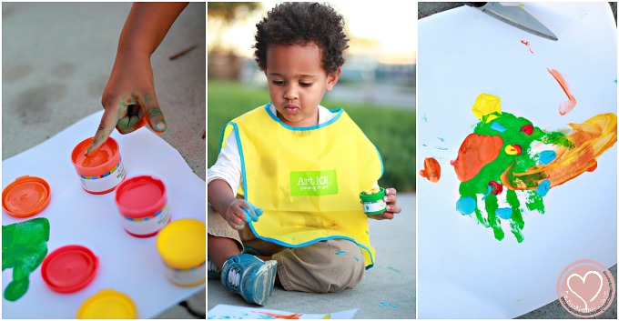 Biracial Boy Learning to Finger Paint