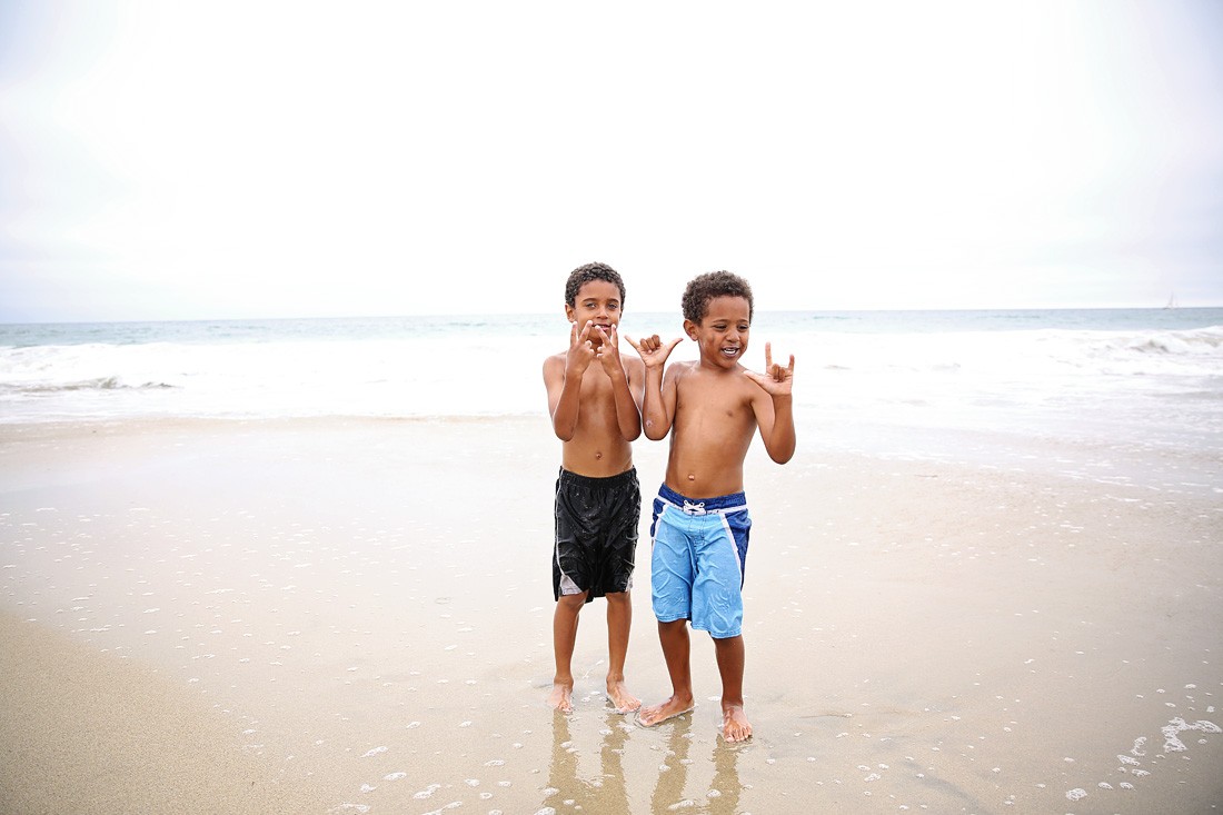 little black mixed boys on the beach
