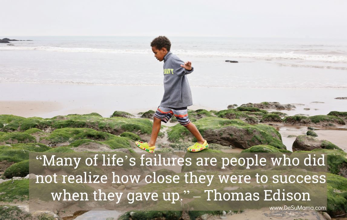 black boy jumping with growth mindset quotes