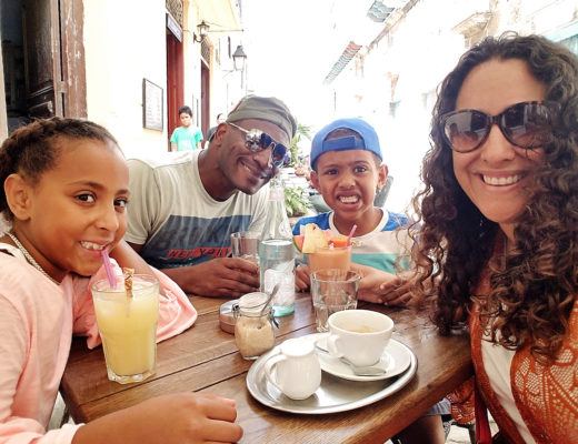 mixed family in cuba having cuban breakfast